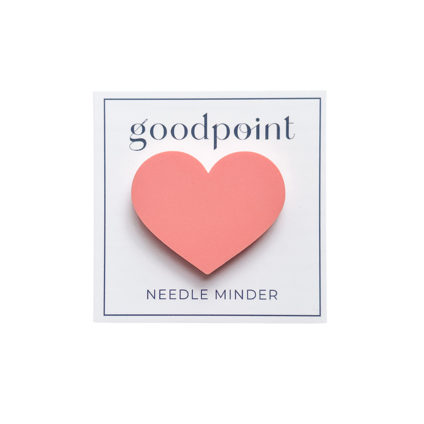 White card stock holds a pink heart magnet. The card contains the goodpoint logo at the top and the words " Needle Minder" at the bottom.