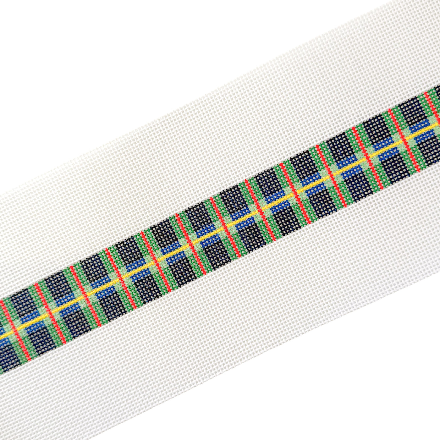 long white needlepoint canvas with a blue, green, red and yellow tartan plaid belt design at center