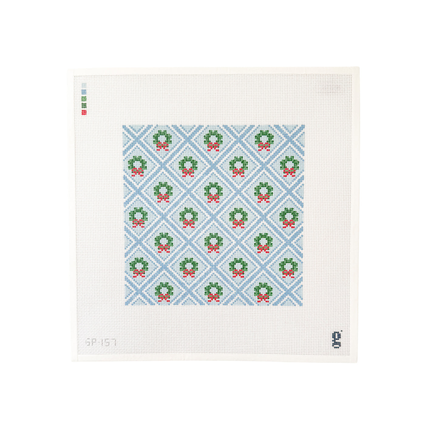 white square shaped needlepoint canvas with light blue trellis design with green wreaths at center of each trellis