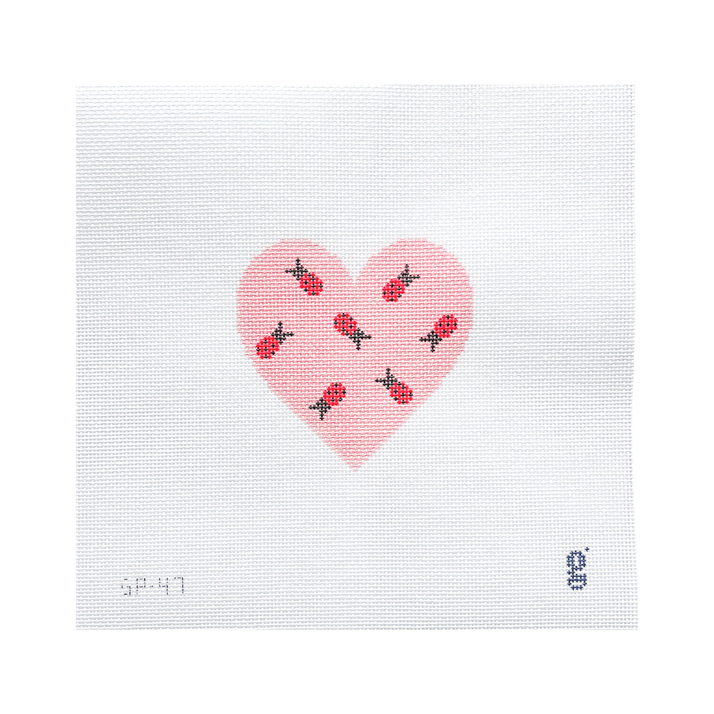 White square needlepoint canvas with a pink heart at center. Within the heart are 7 scattered ladybugs.