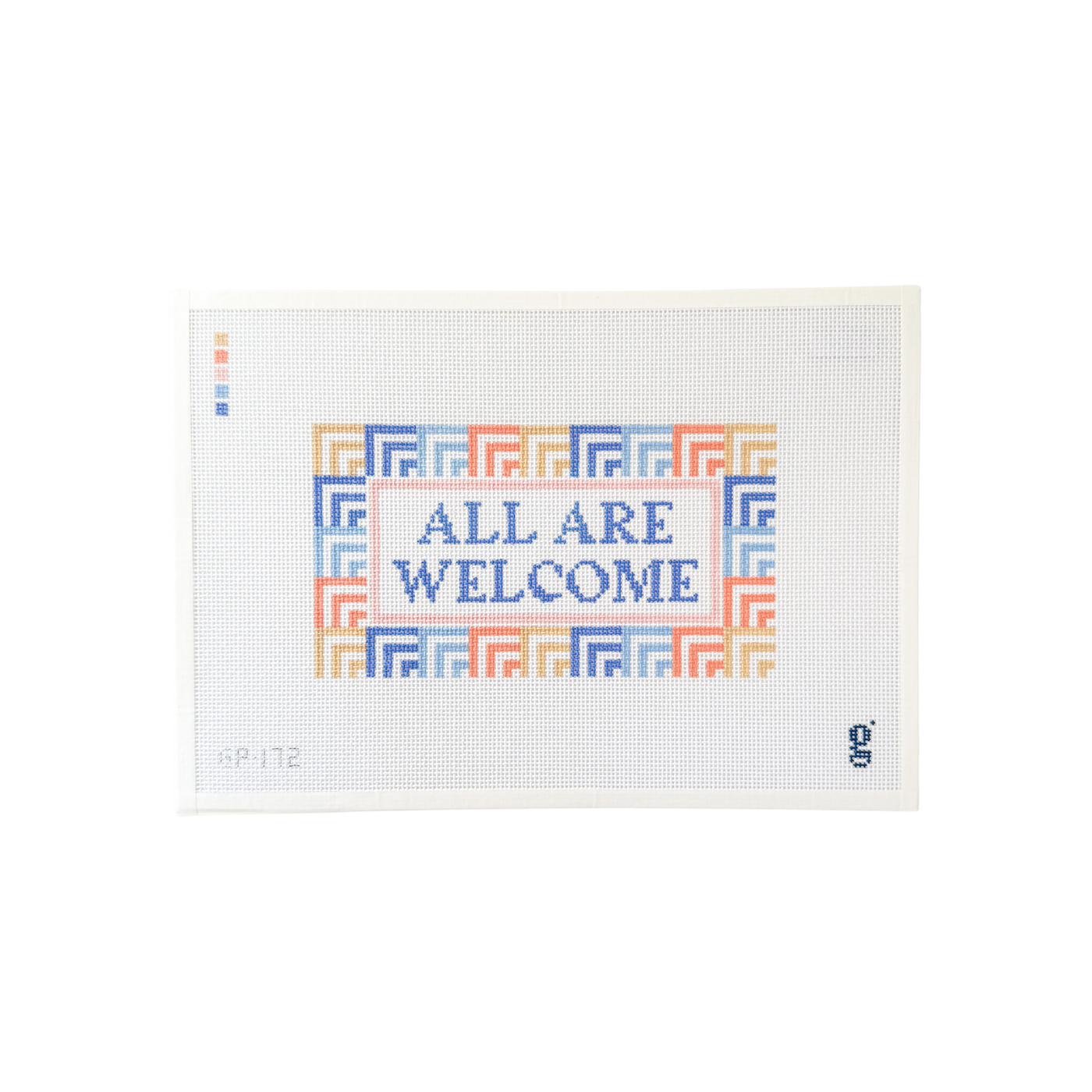 White rectangle needlepoint canvas with coral, periwinkle & sand geometric patterned border surrounding the words "ALL ARE WELCOME" at center