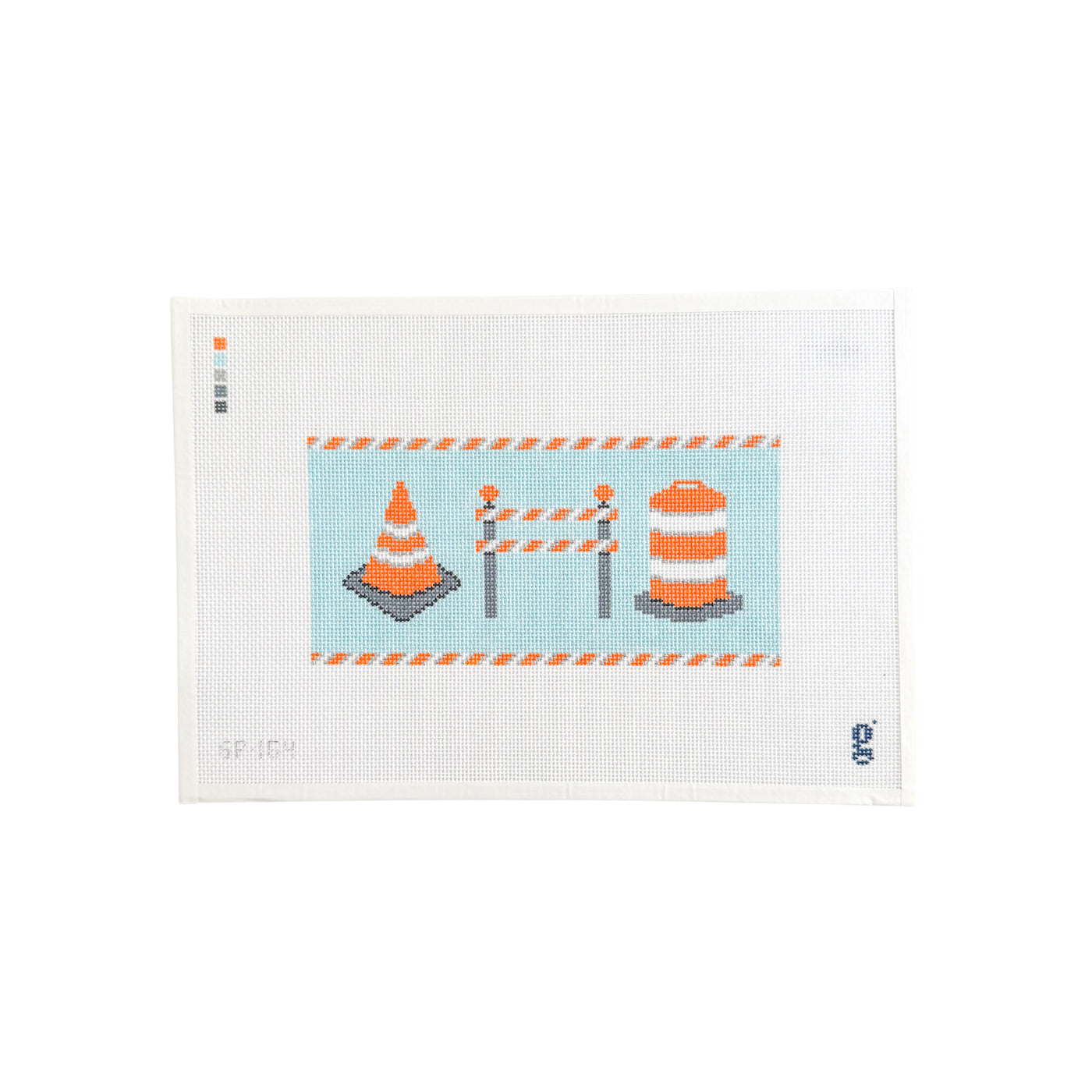 white rectangular needlepoint canvas with light blue rectangle at center with a construction cone, a double barricade and a barrel cone 