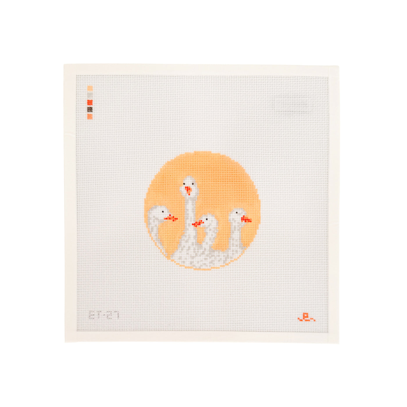 white square shaped needlepoint canvas with yellow circular design at center featuring 4 white geese heads