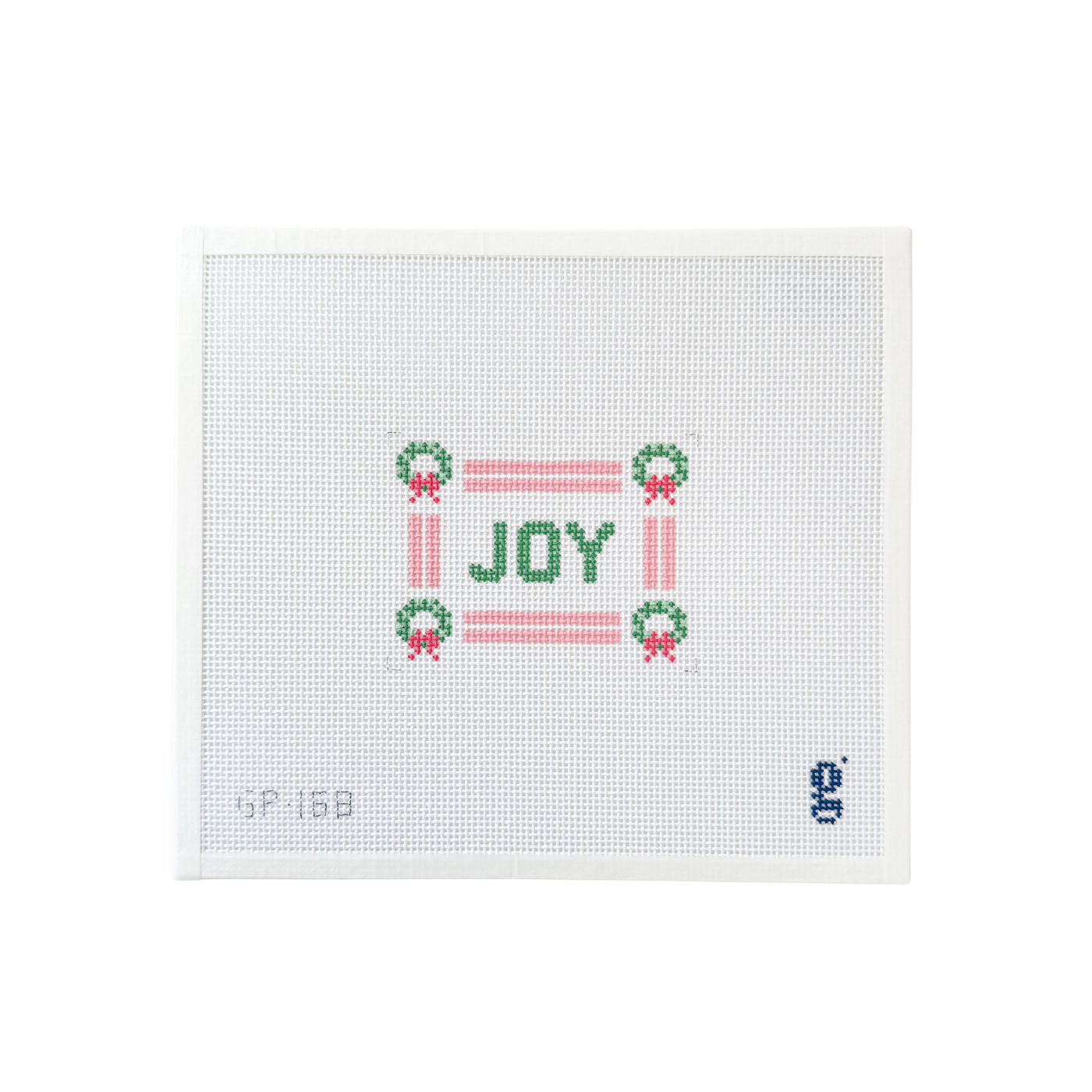white rectangle needlepoint canvas with double stripe pale pink border with green wreaths at each corner and the word "JOY" at center in green text