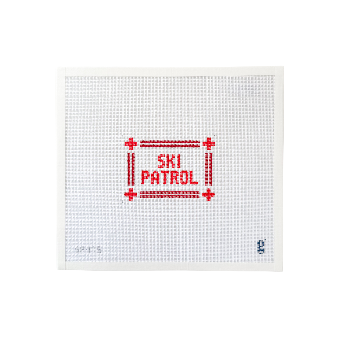 white rectangular needlepoint canvas with double stripe red border and ski cross symbols at each corner and the words "SKI PATROL" at center in red text