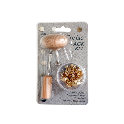 Plastic packaging surround a box of steel tacks, a wooden handled extractor tool and a wooden handle magnetic pusher tool