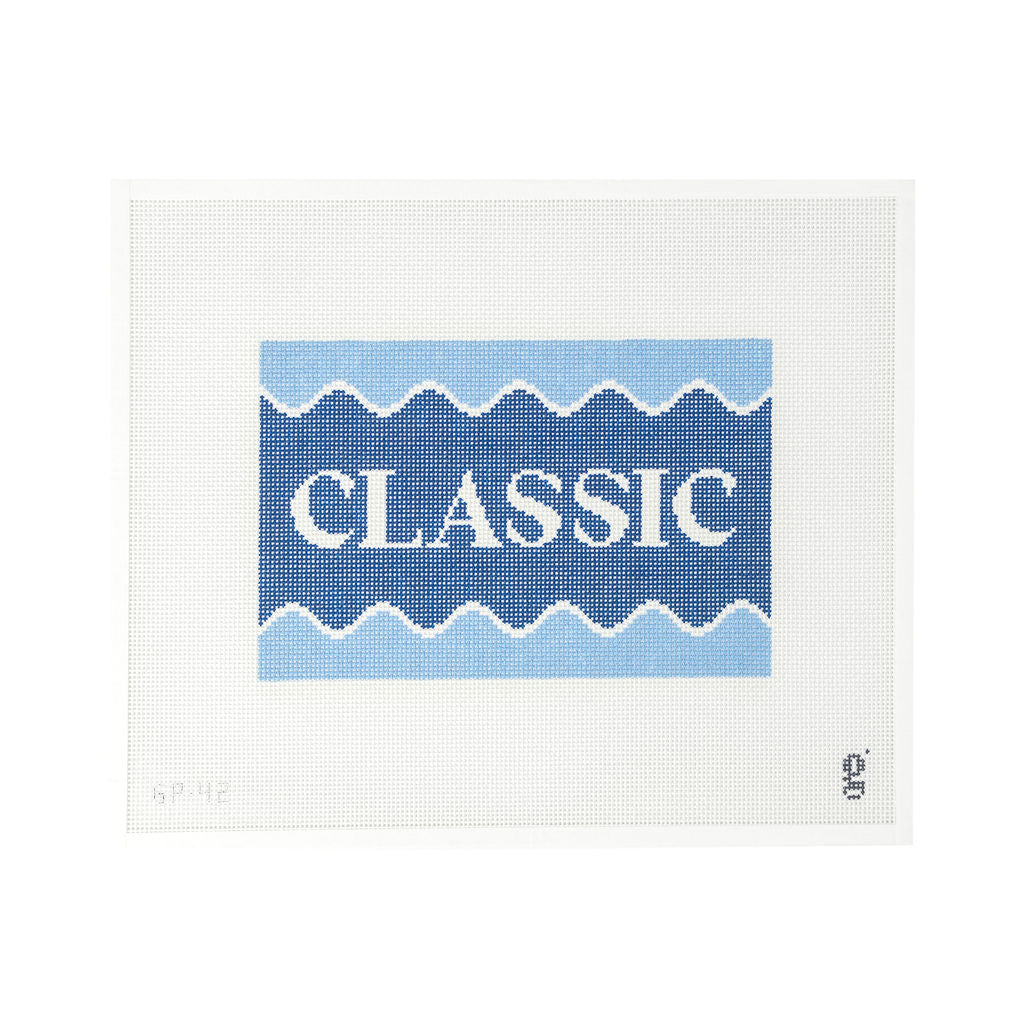 White needlepoint canvas with navy and light blue design with the word "CLASSIC" at center in white