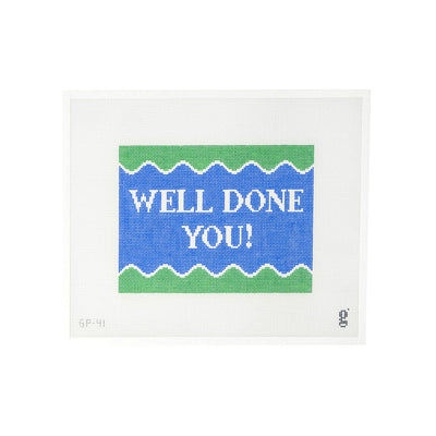 White needlepoint canvas with purple/blue and green design and the words "WELL DONE YOU!" in white font at center