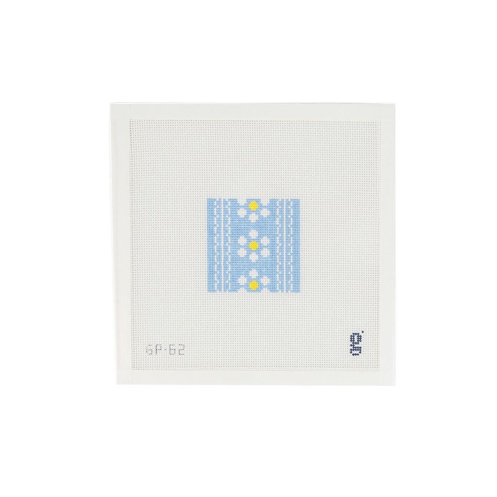 White needlepoint canvas with a light blue painted square design at center featuring white and yellow daisies and 2 vertical scallop stripes