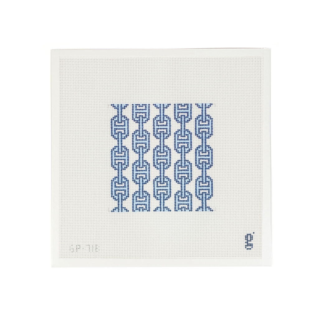 White needlepoint canvas featuring square design of light blue and navy vertical links
