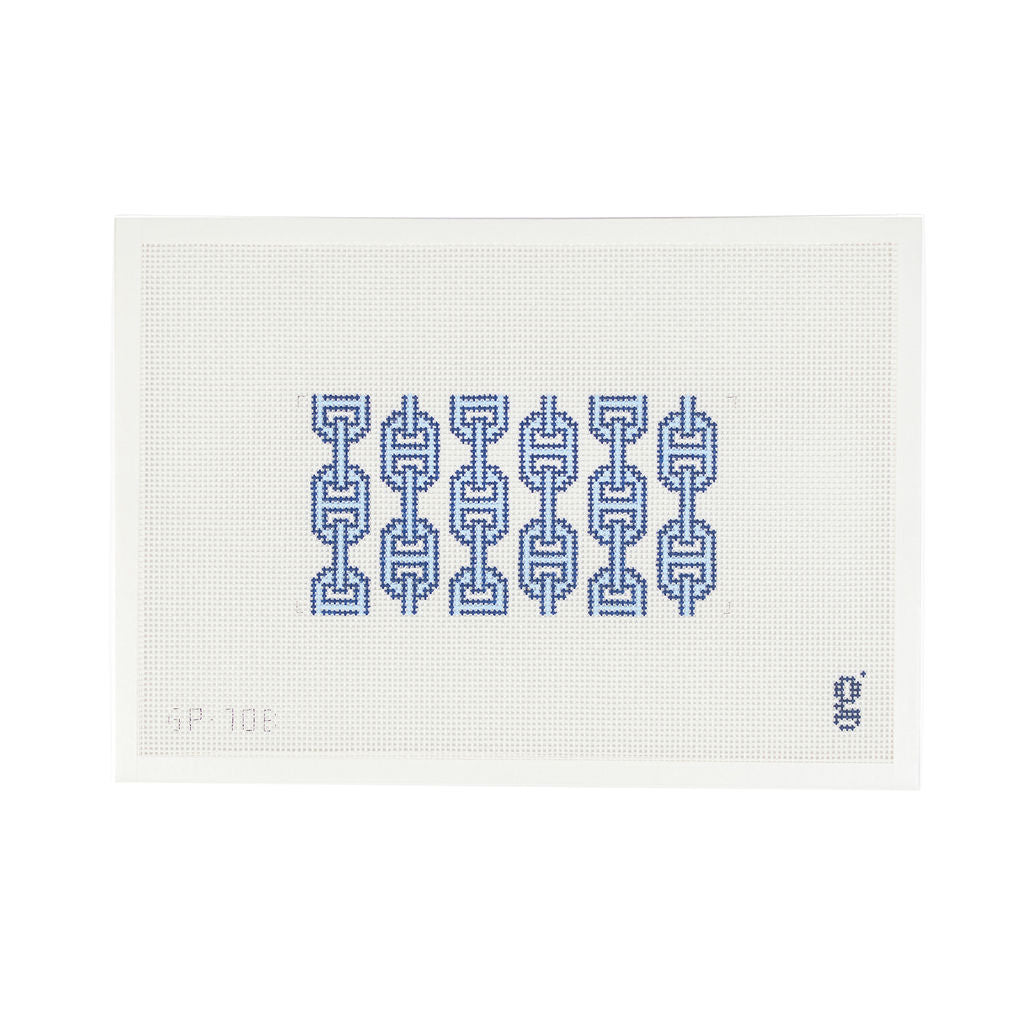 White needlepoint canvas with rectangular design at center featuring light blue and navy vertical links.