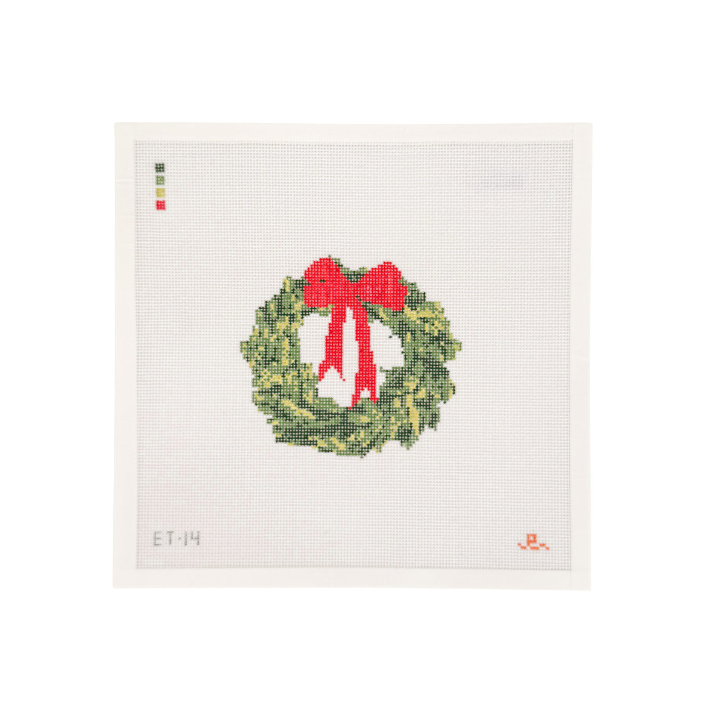 white square needlepoint canvas with green holiday wreath at center with red bow