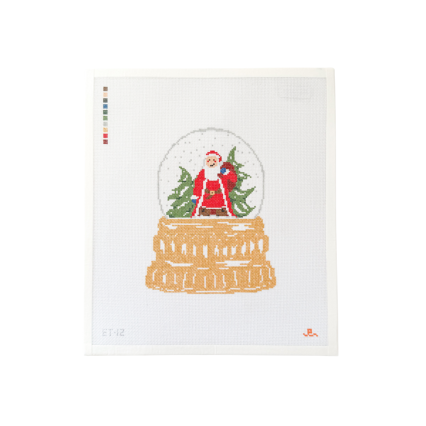 white rectangular needlepoint canvas with design of a snow globe on a gold base with Santa standing in a snowy landscape