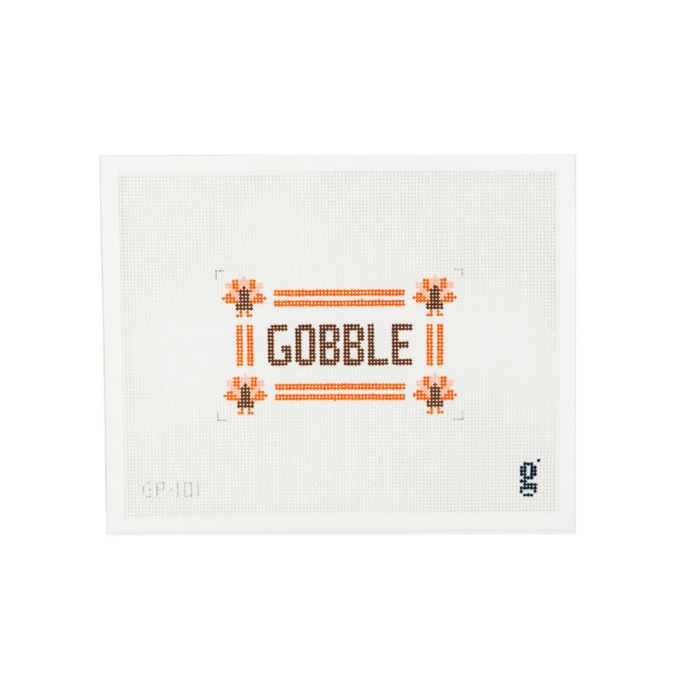 White needlepoint canvas with orange border with turkey icons at each corner and the word "GOBBLE" at center in brown block text