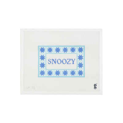 White needlepoint canvas with a aqua rectangular border with 6 pointed periwinkle stars surrounds a white center with the word "SNOOZY" in peri winkle text