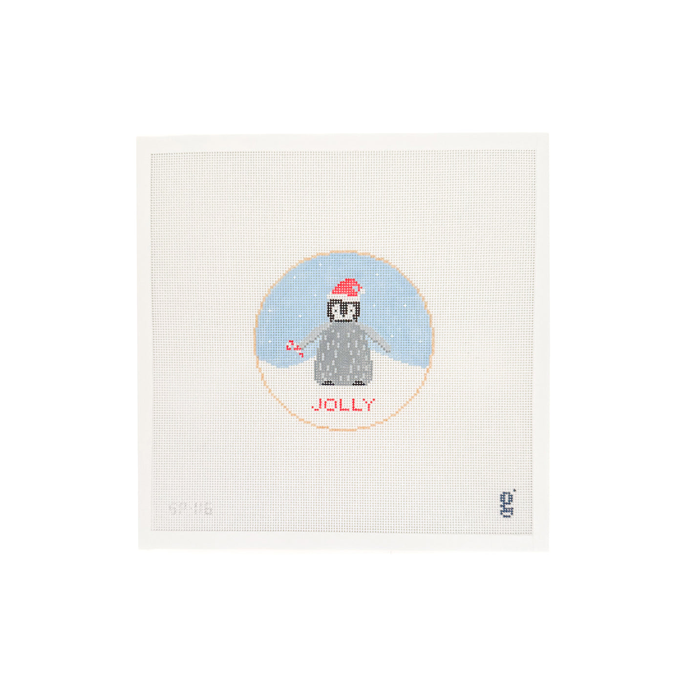 White needlepoint canvas with light blue circular design with a baby penguin wearing a Santa hat standing in snow and the word JOLLY in red block font beneath