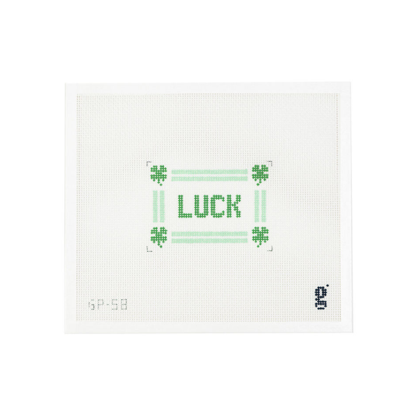 White needlepoint canvas with the word LUCK in green text at center, surrounded by a mint green striped border and 4 leaf clovers at each corner