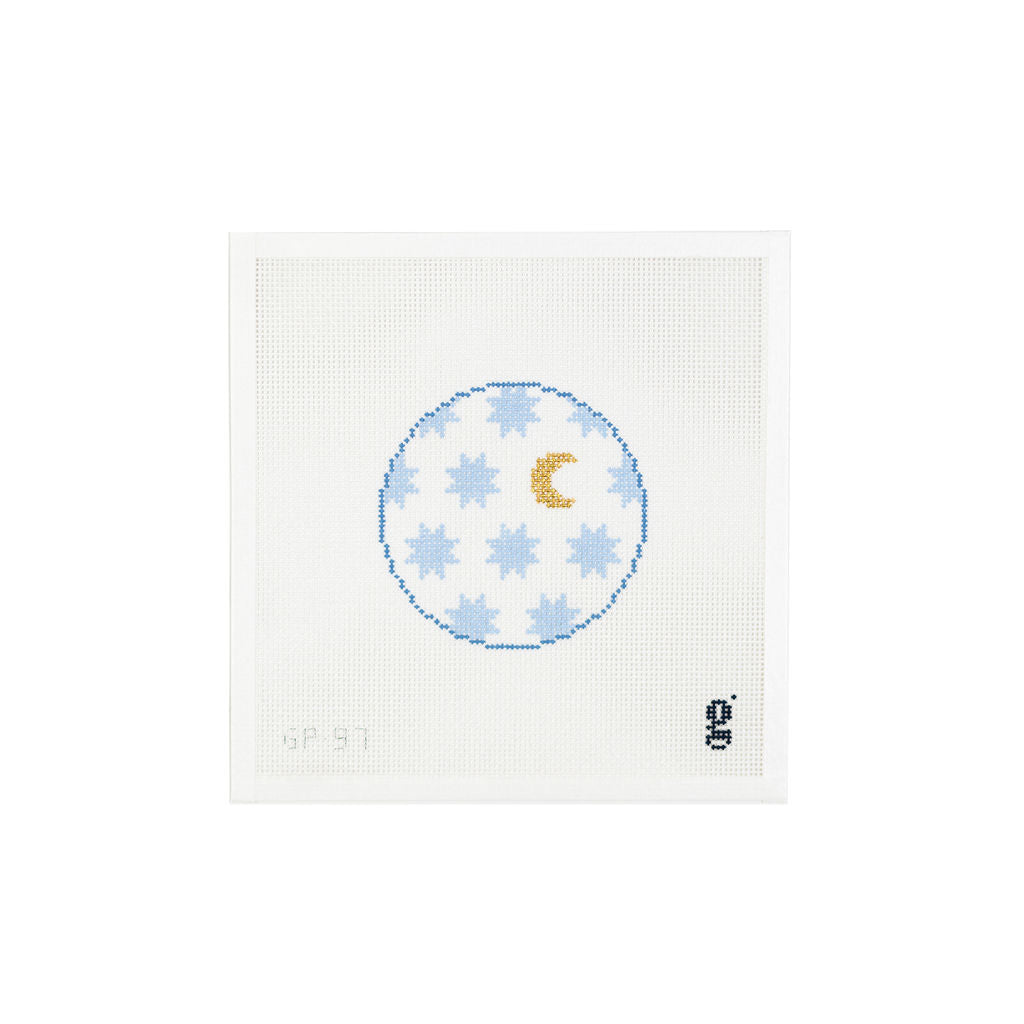 White square needlepoint canvas with round design at center of light blue six pointed stars and a single gold crescent moon.