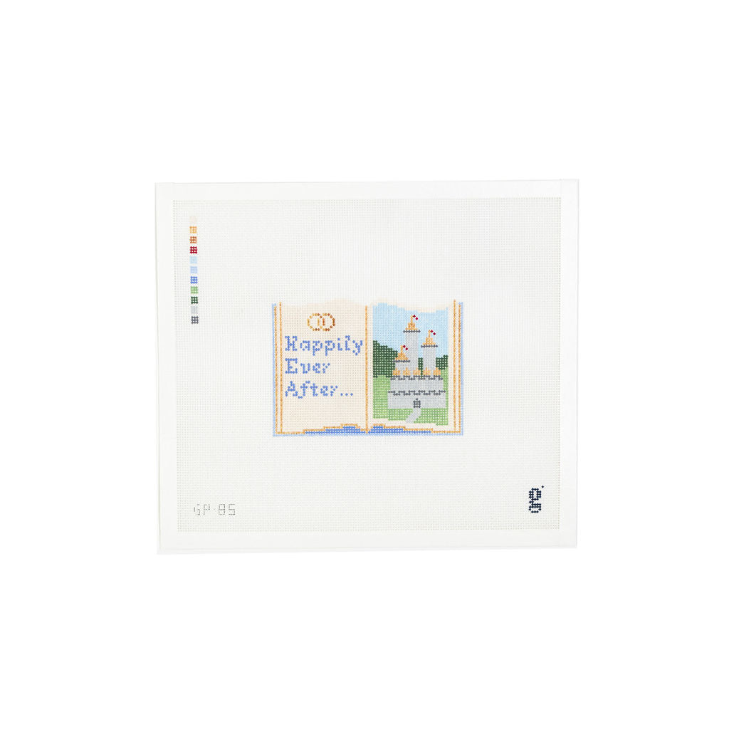 White needlepoint canvas with painted design of an open storybook. A fairytale castle is on the right page while the words "Happily Ever After" beneath interlocking wedding rings is on the left page