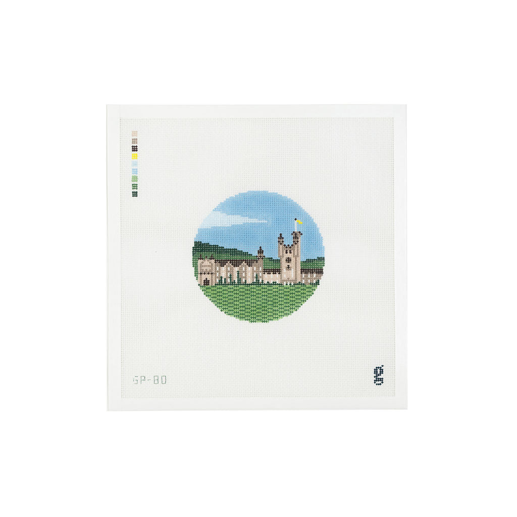 White square shaped needlepoint canvas with round design at center depicting Balmoral Castle in Scotland