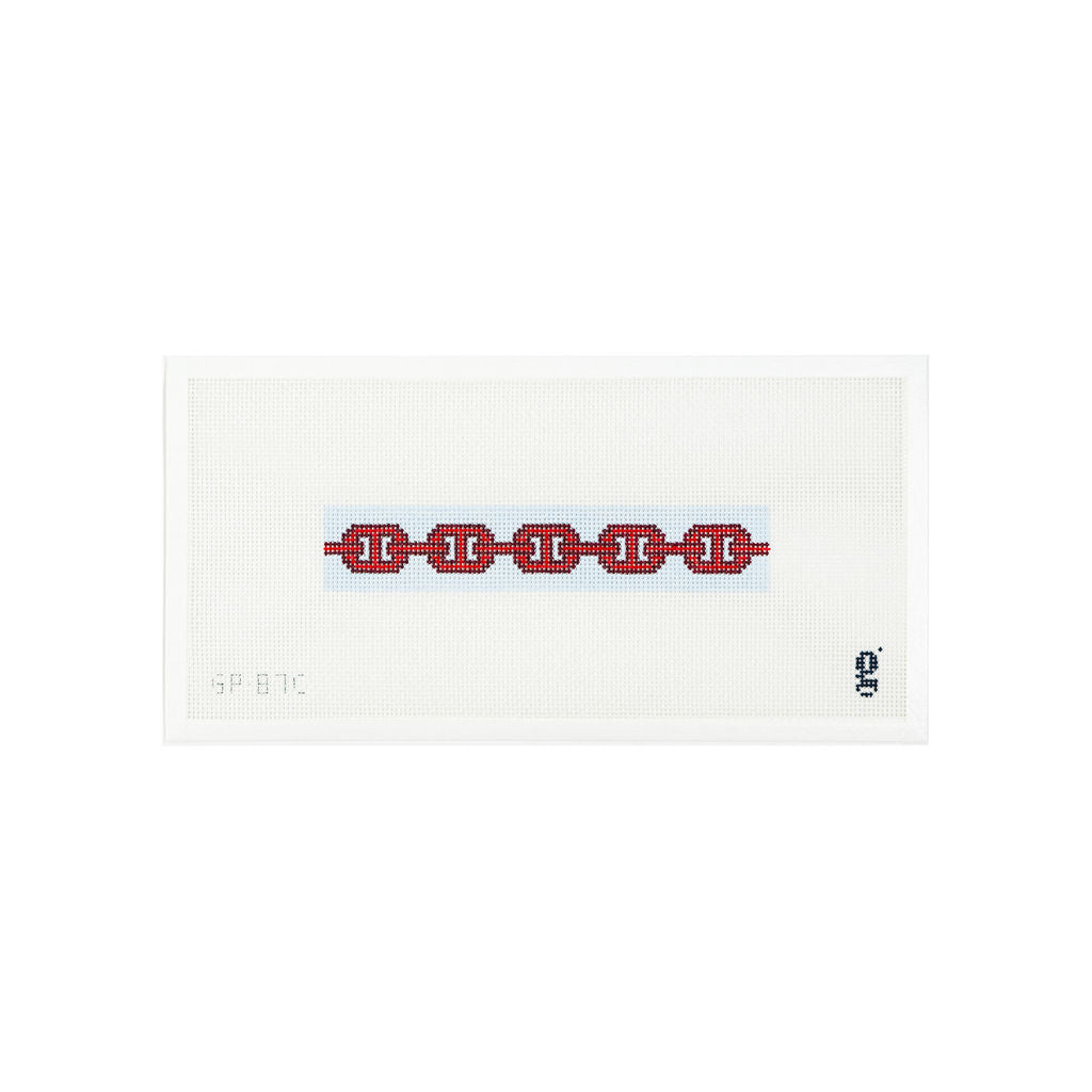 White needlepoint canvas with light blue colored narrow rectangle and a red and burgundy links pattern