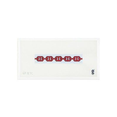 White needlepoint canvas with light blue colored narrow rectangle and a red and burgundy links pattern