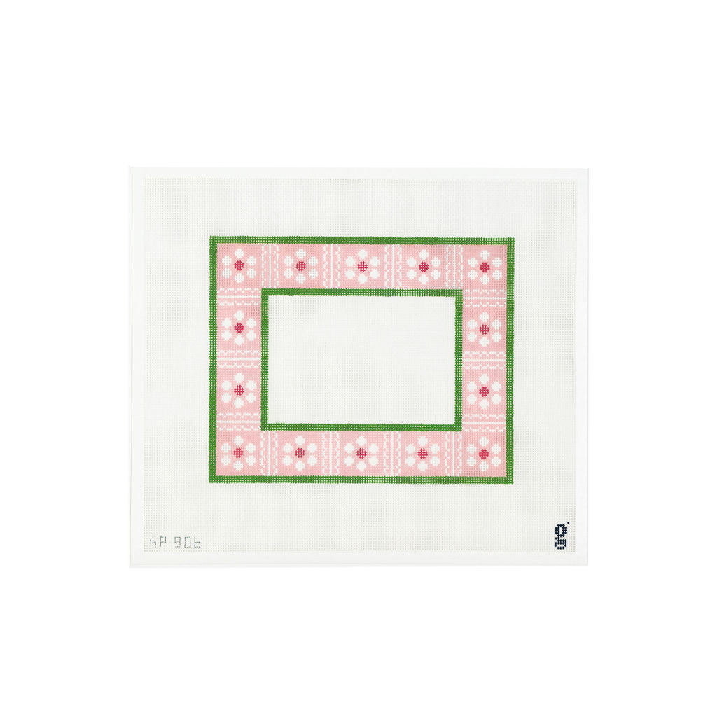 White needlepoint canvas with pink painted border with white and yellow daisies divided by white scallop details 