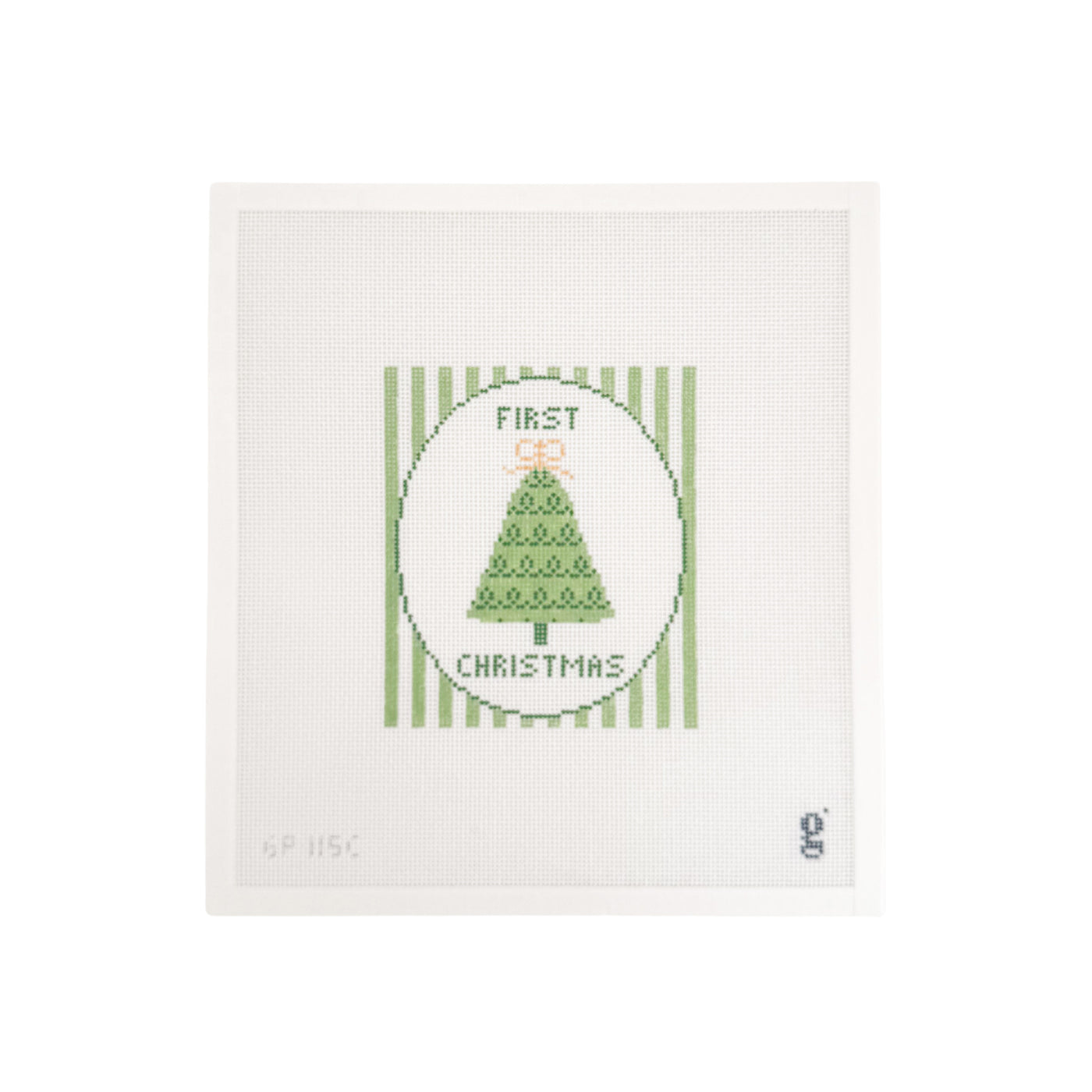 White needlepoint canvas with green and white striped rectangular design featuring a white oval at center with a green Christmas tree and the words "FIRST CHRISTMAS" at top and bottom respectively.