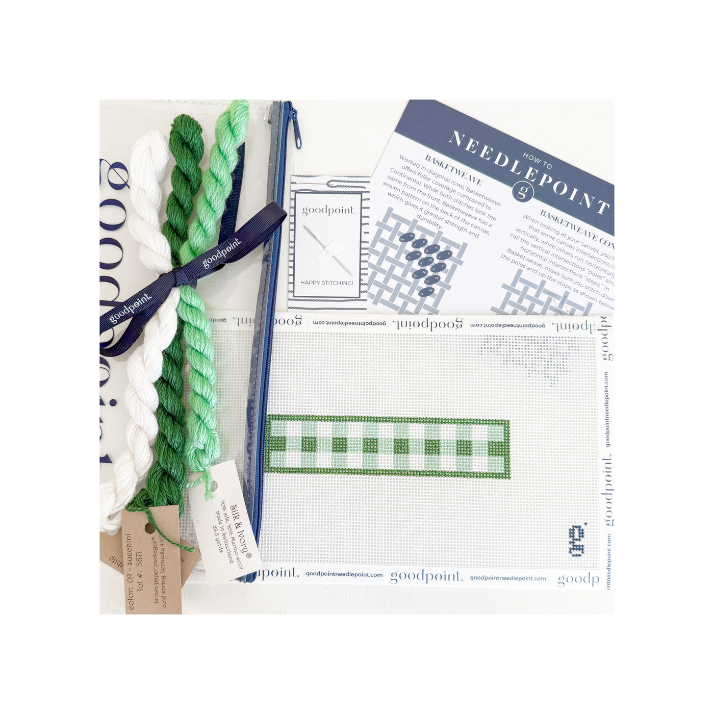 White and green gingham key fob needlepoint canvas with threads, clear project bag, and instruction postcard