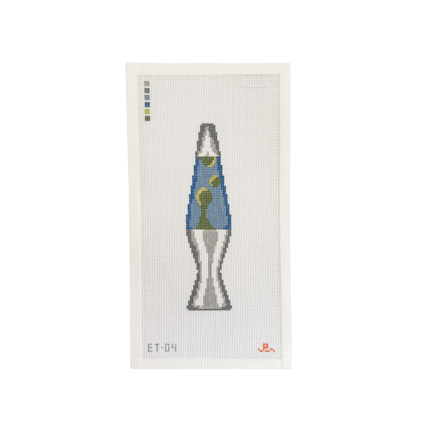 White rectangular needlepoint canvas with illustration of a blue and green lava lamp at center