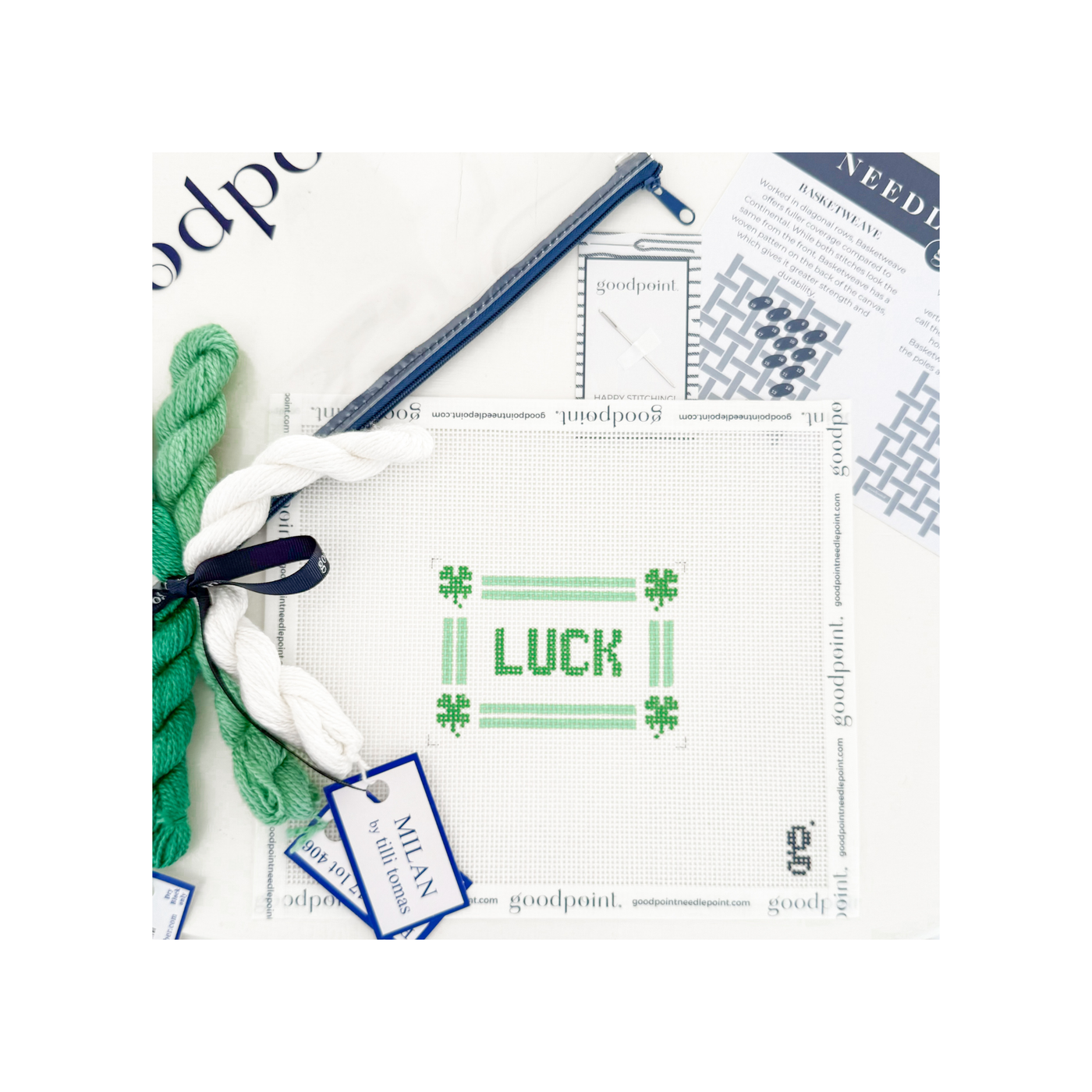 Green and white "LUCK" needlepoint canvas with threads, clear project bag, and instruction postcard