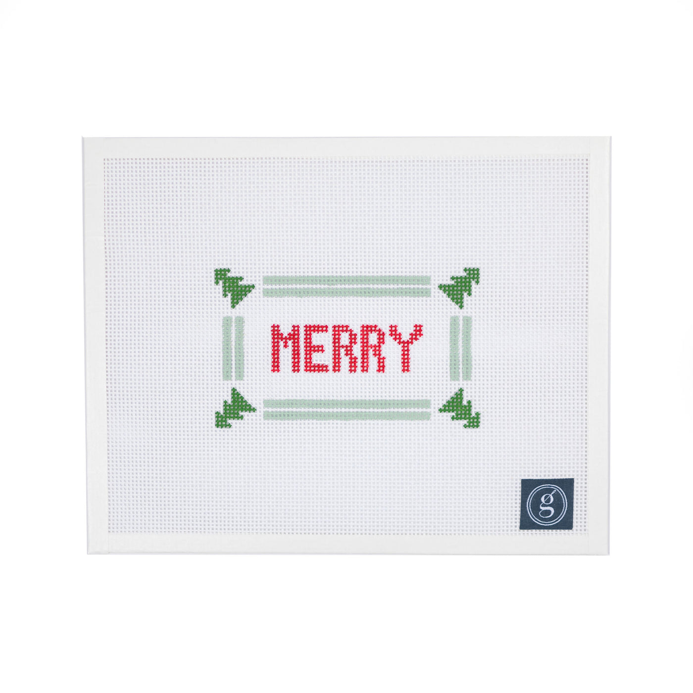 White needlepoint canvas. At center is the word "MERRY" in block red letters. Word is surrounded by a mint green double stripe border with green evergreen trees in the four corners. A navy Goodpoint logo is located in the bottom right corner.